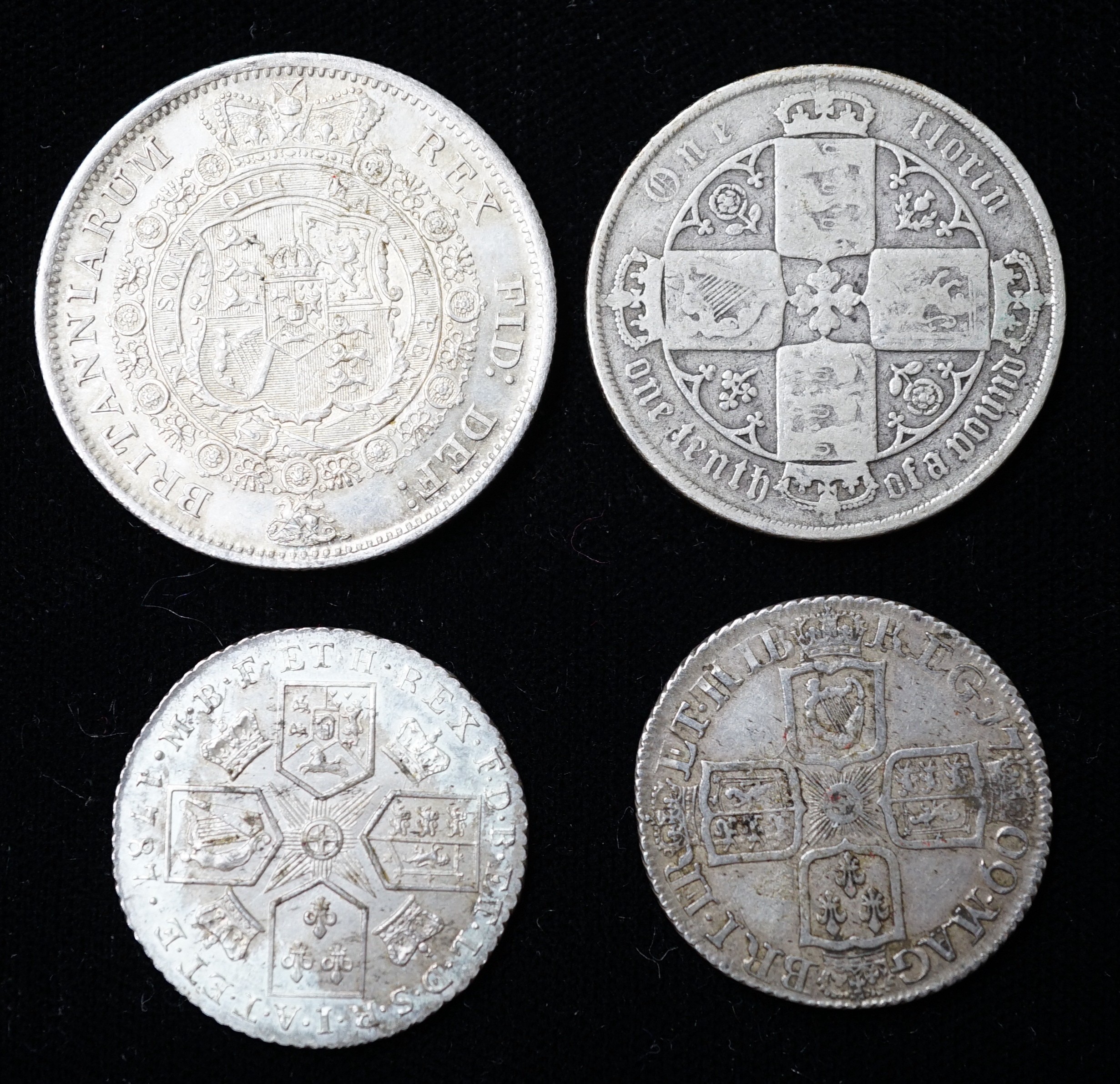 A Queen Anne shilling 1709, about VF, a George III halfcrown, 1817, EF and a George III 1787 shilling, EF and a Victoria Gothic florin